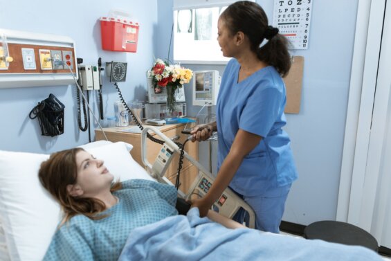 Nurse measuring the blood pressure of a patient.